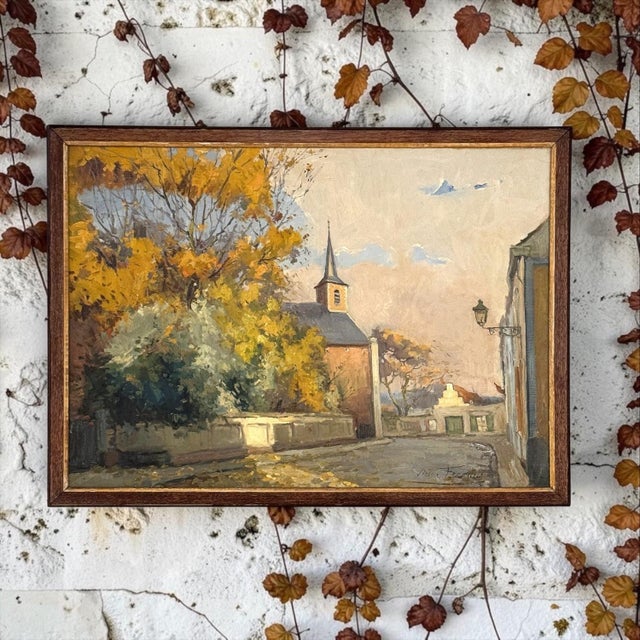 A framed early 20th century Belgian oil on canvas by Victor Fermans, titled Village View, full of the quiet warmth of an...