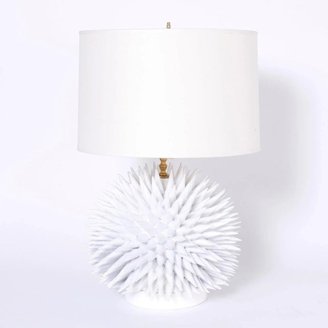 Dramatic pair of table lamps crafted in terracotta, glazed white, and having an elaborate composition resembling a sea...