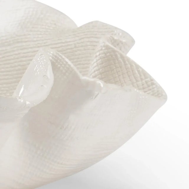 Enhance your modern home with freeform bowl. This hand glazed white Italian ceramic bowl has a freeform shape that...
