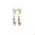 This pair of estate earrings centers on a 4.78-carat diamond in a round brilliant cut for lively, classic sparkle. It is...