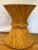 A striking mid-century rattan pedestal table in the classic sheaf-of-wheat form, circa 1970s. Expertly crafted from...