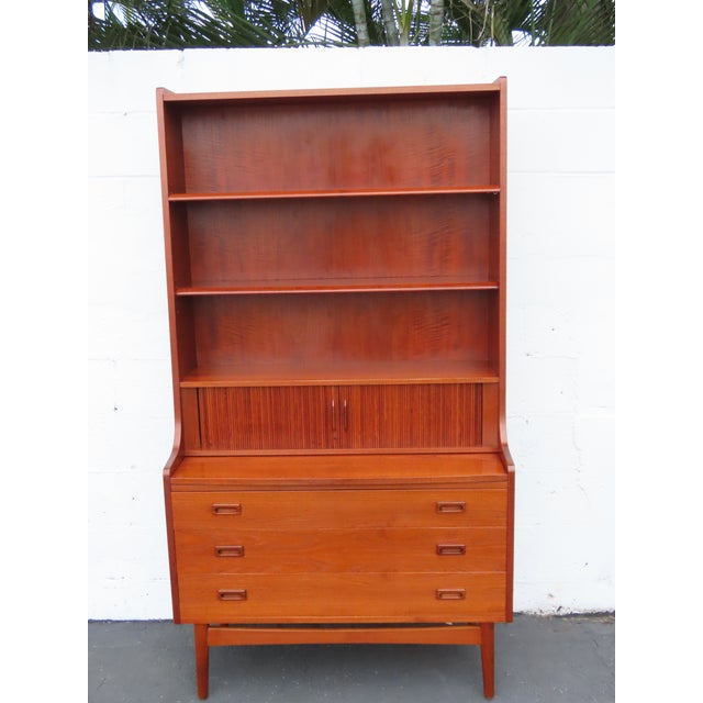 A beautiful and highly functional example of Danish mid-century design. We believe this elegant 1960s cabinet was crafted...