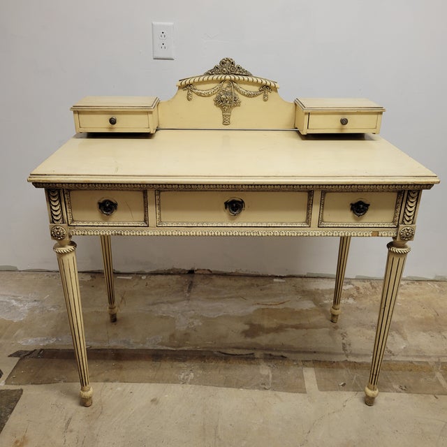 This desk or dressing table was crafted by Northern Furniture Company in the 1920s and showcases their signature “Old...
