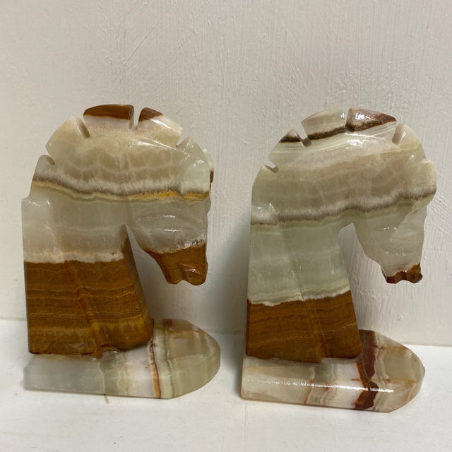A Pair of vintage Onyx stone carved horse head book ends.