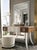 Handcrafted in Italy, this dressing table features a striking combination of a white lacquer finish and silver leaf...