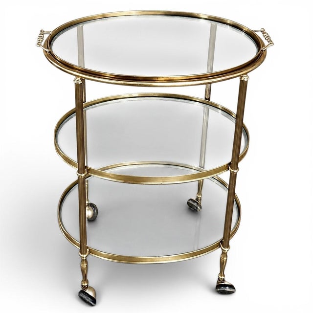 Mid-Century Brass & Glass Oval Bar Cart creates a charming way to serve drinks, desserts, coffee service or treats with...