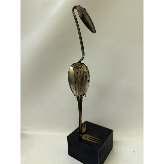 This striking 11.5-inch mid-century modern mixed-metal sculpture depicts a stylized water bird (crane/heron) expertly...