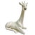 A pair of beautiful and graceful white porcelain giraffes made by Fitz and Floyd in 1971. Both giraffes are in seated...