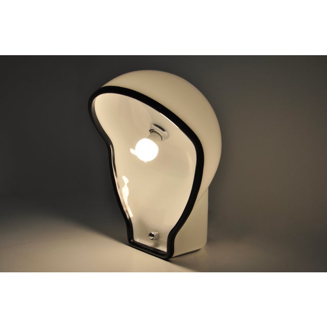 Rare white plastic lamp. Stamped Harvey Guzzini. Wear due to time and the age of the lamp. This piece has an attribution...