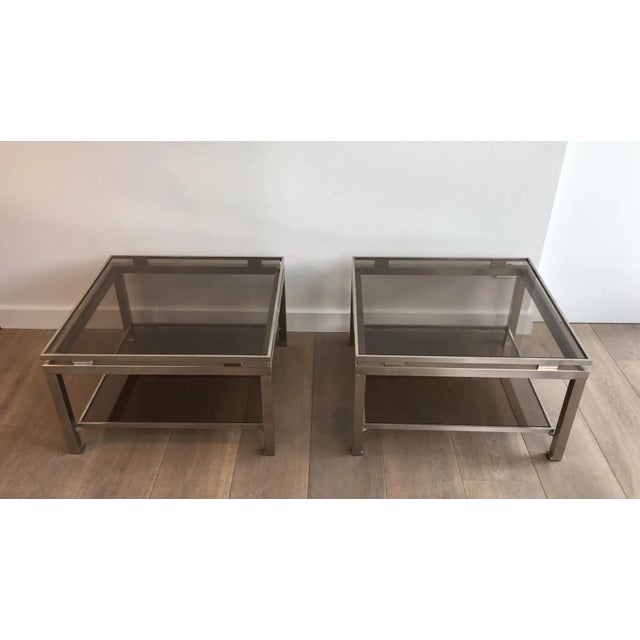 This pair of side tables is made of brushed steel and has smoked glass shelves. The model is really nice and the quality...