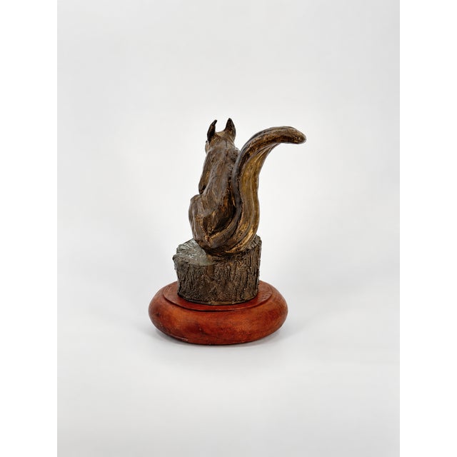 Stockpiling is an original lost-wax bronze sculpture by Franco Vianello, capturing the charm and character of a squirrel...