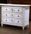 Bring refined French elegance to a bedroom, entry, or living space with this antique Louis XVI style commode, crafted in...