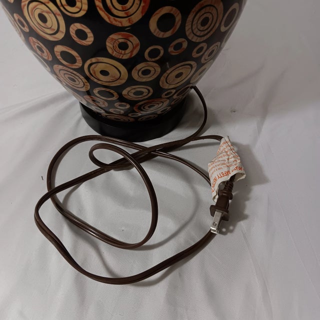Ebony Vintage Mid-Century Modern Wood Lamp With Black Base Color and Embellished With Light Tan Circles With a Touch of Red Grain Lines For Sale - Image 8 of 12