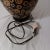 Ebony Vintage Mid-Century Modern Wood Lamp With Black Base Color and Embellished With Light Tan Circles With a Touch of Red Grain Lines For Sale - Image 8 of 12