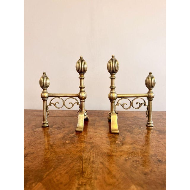 Fine quality pair of antique Georgian brass fire dogs, having a quality pair of Georgian brass fire dogs with brass balls...