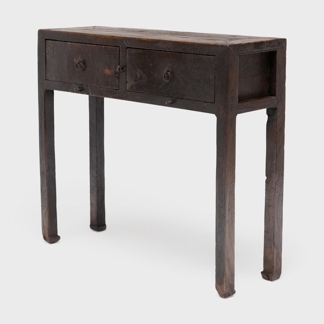 This clean-lined console table dates to the late 19th century and was likely used as a small offering table or as a...
