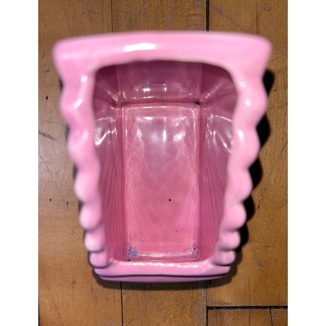 Bring a pop of retro charm to your space with this vintage pink ceramic fan vase planter! Its unique fan design doubles as...
