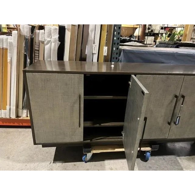 Custom made credenza made by Old Biscayne designs. Done in an Iron and Charcoal finishes. Four doors and interior storage....