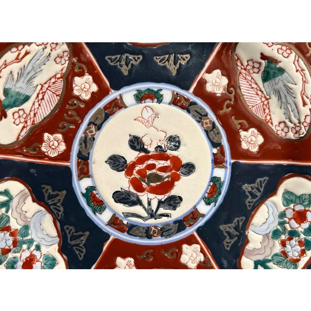 A beautifully hand-painted Japanese Imari-style porcelain plate dating from the late Meiji to early Taishō period (circa...