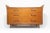 A refined and sculptural mid-century Italian chest of drawers, attributed to Vittorio Dassi, embodying the sophisticated...