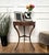 Beautiful antique Italian solid walnut side table or console table features a round top with brass frame over a central...