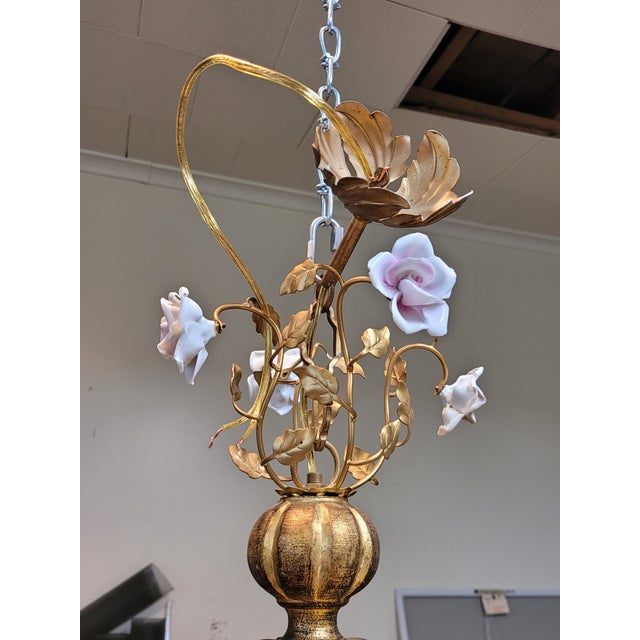 You will love this stunning Italian gilt wood and porcelain chandelier. This chandelier has a gilt wood central base and 4...