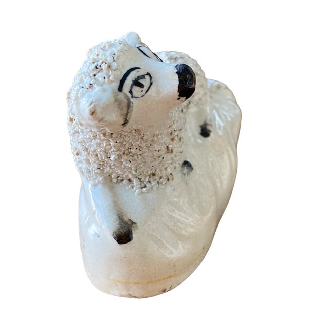 Antique Victorian era Staffordshire figurine of a porcelain sheep laying on a white base. Confetti fur texture. Yellow...