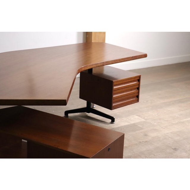T96 boomerang executive desk, designed by italian architect and designer osvaldo borsani for tecno in 1956. the desk is...