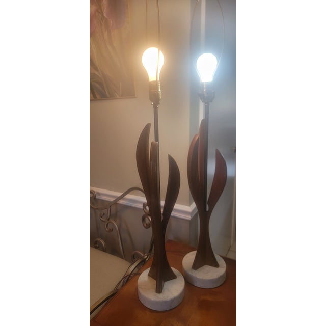1960's sculptural mid-century wood table lamps with Carrara marble base. Featuring sculptural "leaf" shaped wooden bodies...
