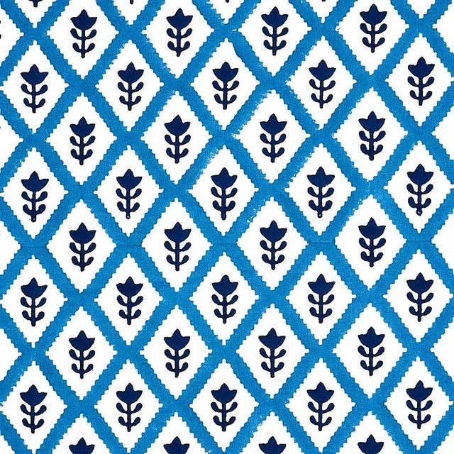 A delightful small-scale floral-and-diamond pattern, hand-block printed in India by master craftsmen. Minimum order of 2...