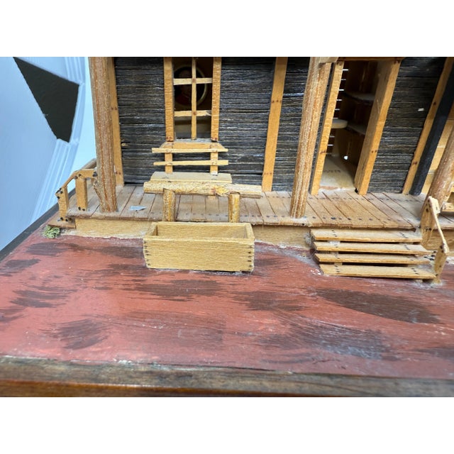 A wonderfully detailed hand crafted model of an old Wild West town. It features a saloon, a post office, drug store and...