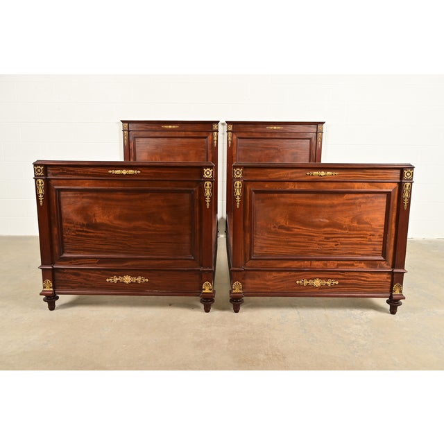 A beautiful pair of antique French Empire twin beds In the manner of Jacob-Desmalter France, Late 19th Century Carved...