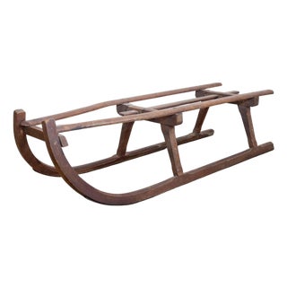 Rustic 19th Century French Wooden Sled with Weathered Patina and Curving Base For Sale