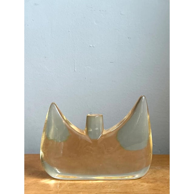 This vintage Lucite abstract sculpture presents a striking, biomorphic silhouette, its wide, wing-like form curving...