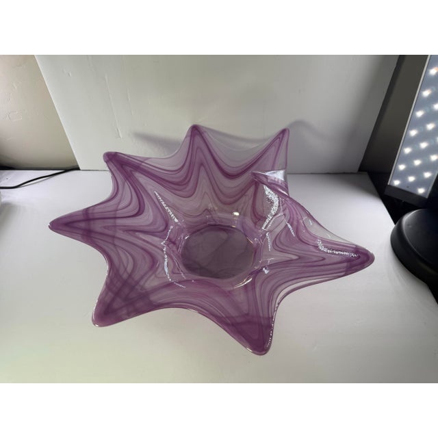 This hand blown art glass centerpiece bowl features a dramatic free form starfish or splash design with eight prominent...