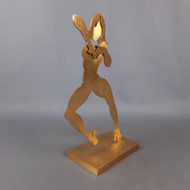 Wonderful modernist sculpture, depicting a dancing woman, satin brass structure, made with laser cutting technique, by the...