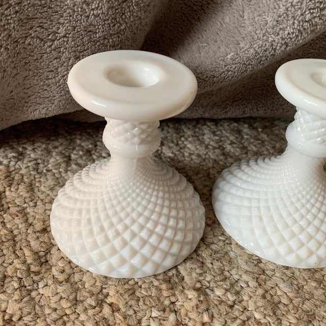 Here is a pair of mid century vintage opalescent white milkglass candlestick holders. They measure 4” in height and 3.5”...