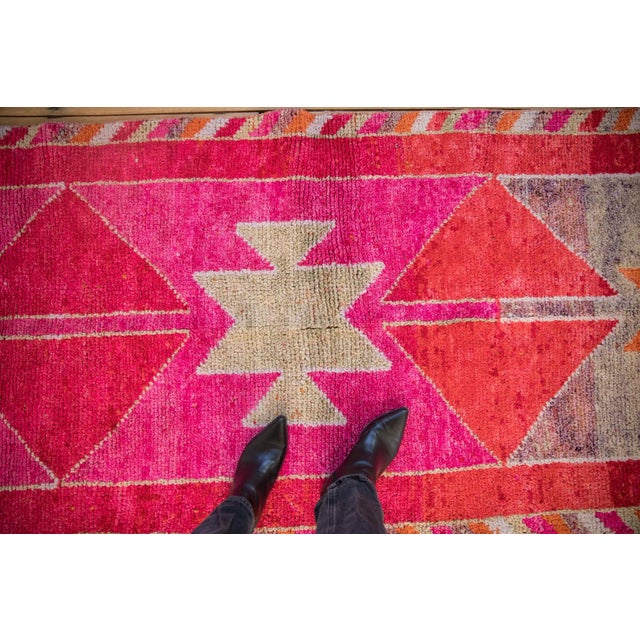 :: Abstract simplistic and geometric serrated medallions wrapped by a barber pole main border on either side. Colors and...