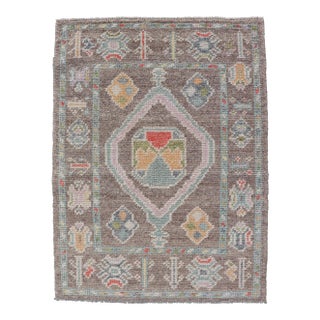 Small Turkish Oushak Rug With Soft Brown Ground and Geometric Pastel Motifs For Sale