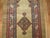 An authentic early 20th century Persian Serab runner with 2 geometric medallions on a camel field and multi-band border in...