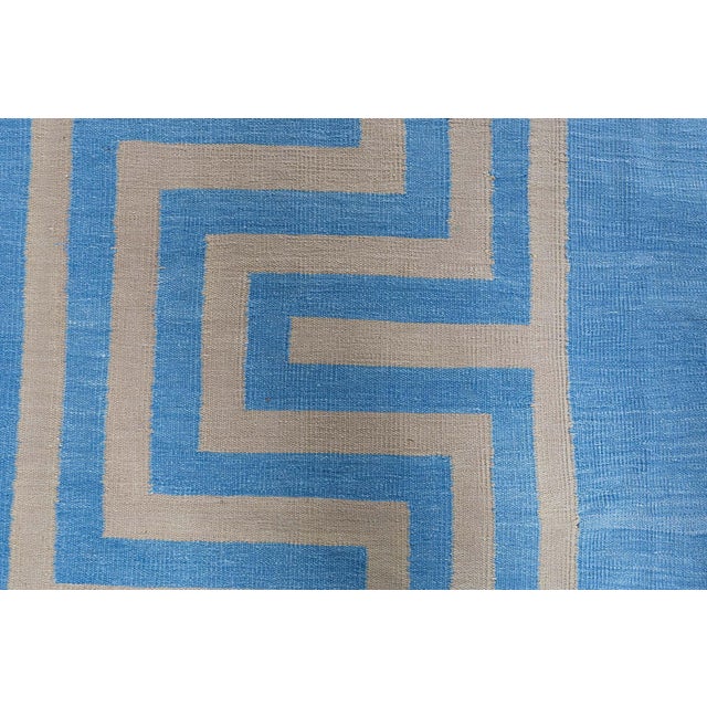 This impressive vintage Indian Dhurrie rug, woven circa 1950, showcases the refined simplicity and balanced geometry...