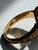 A distinctive vintage ring in 925 sterling silver with a rich gold vermeil finish, featuring an elongated marquise or...