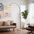 A sweeping arc of black nickel and white marble, engineered to light a room like a chandelier - without touching the...