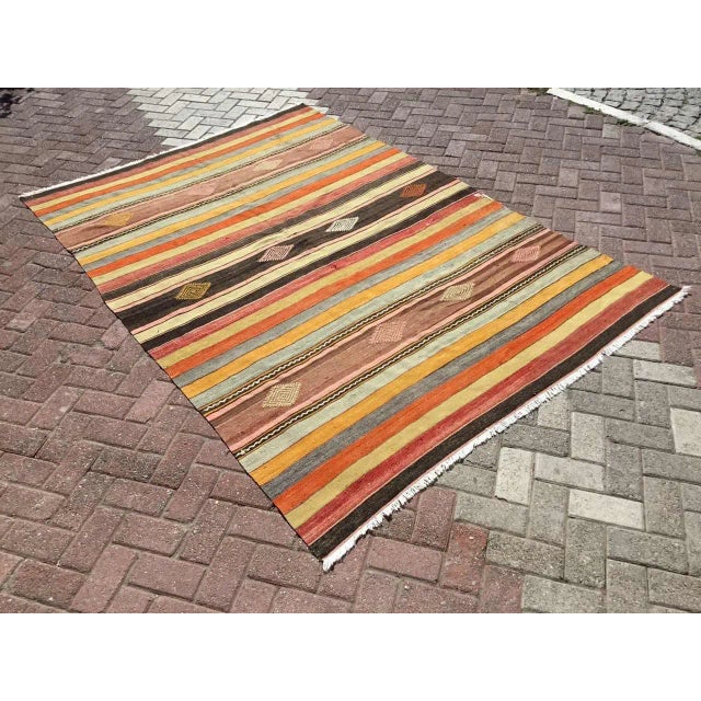 This beautiful, vintage, handwoven kilim is approximately 60 years old. It is handmade, of very fine quality hand spun...