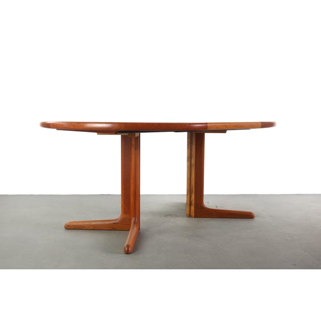 Gorgeous Danish Teak extension table with one leaf. Sturdy with stunning grain. Unbeatable versatility! Make it yours today!