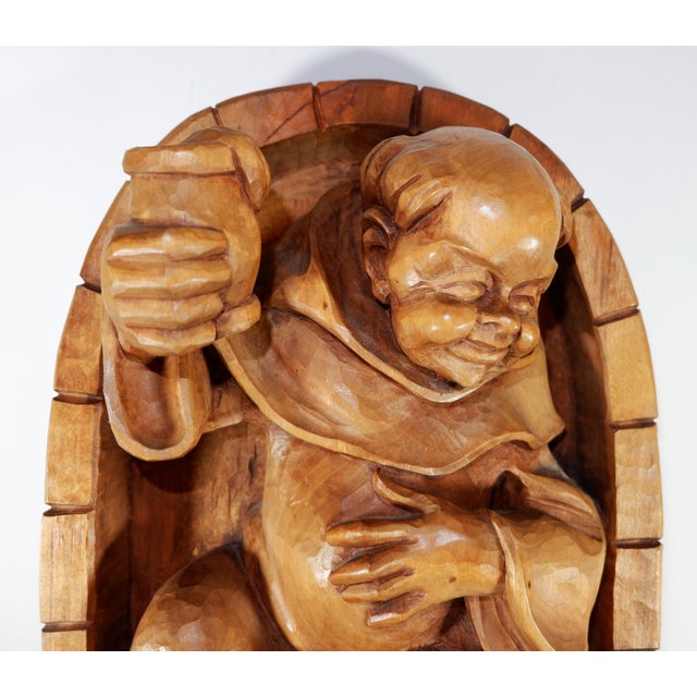 A vintage wood carving of a monk with wine glass. Carving is from Oberammergau in Germany, which is known as a wood...