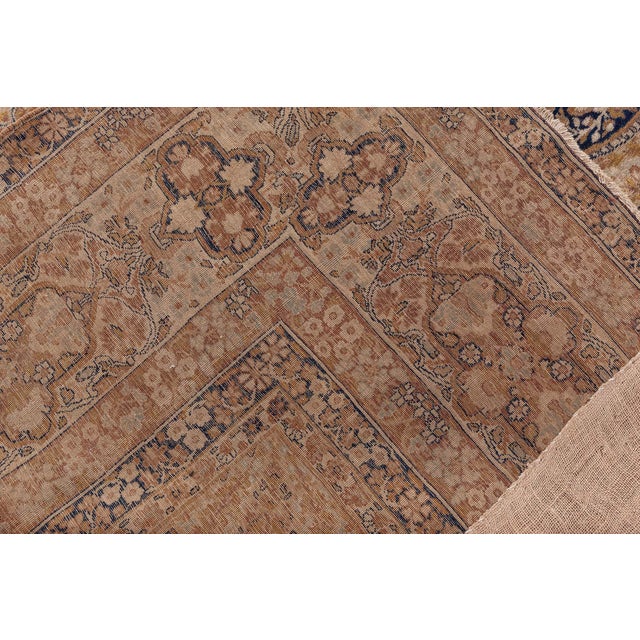 A masterwork of Persian textile artistry, this 19th-century Kirman rug stands as a testament to the refined craftsmanship...