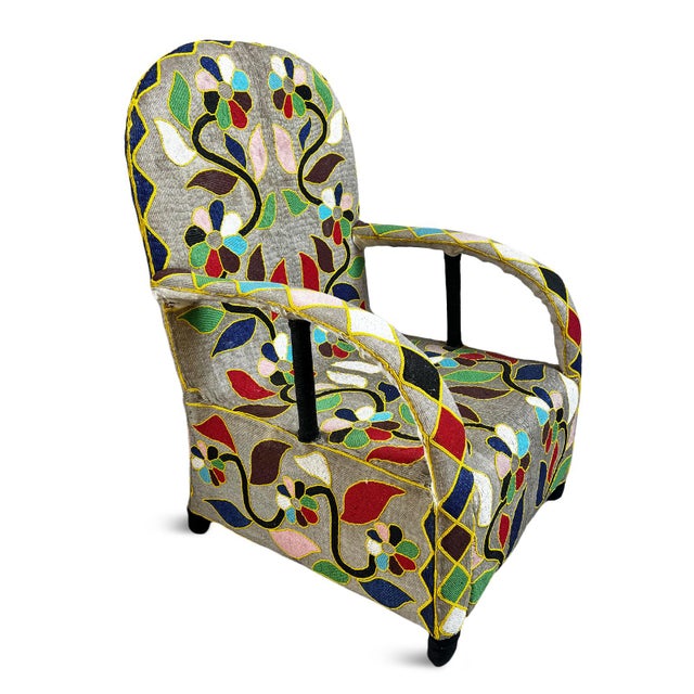 Vintage West African hand beaded tribal arm chair from Yoruba Nigeria. Sandy tan/beige background with multi-colored...