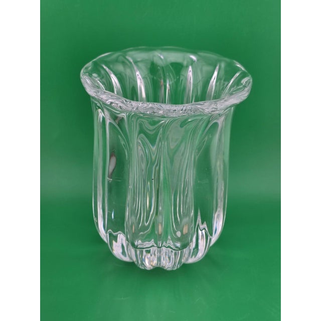 The Vintage Orrefors Art Glass Vase is a rare and exquisite piece of Scandinavian craftsmanship. Standing at 6.5 inches...