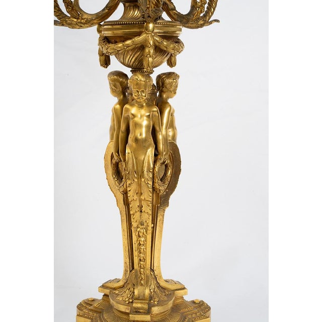 Description: Pair of gilded bronze candelabra/flambeaux dating from the Napoleon III period in the second half of the 19th...